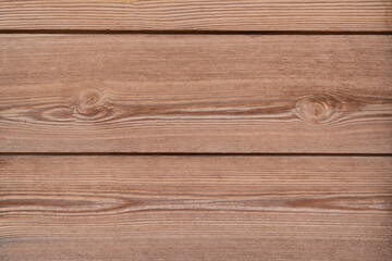 Fototapeta premium Brown wooden texture background with space for text. Top view of natural tree plank. Grunge wooden background. The surface of the new brown wood. Vintage rustic style. Wooden tiles pattern