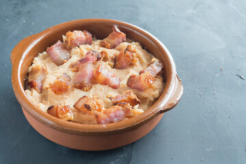 mashed potatoes with slice of bacon