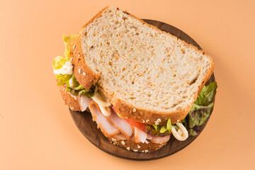 Sandwich of tomato, lettuce and smoked turkey