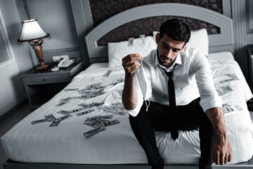 Lonely stressed out businessman alone in her bed during covid-19 virus outbreak in home quarantine lockdown.