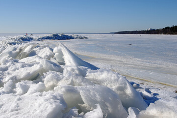 Arctic-like ice-hummock in Finnish Gulf near Zelenogorsk town' beach (St.-Petersburg) in sunny cloudless winter midday