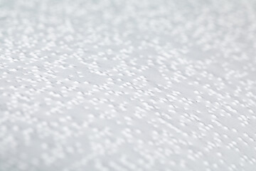 Page of the book with Braille text, close-up. Concept of education for blind people
