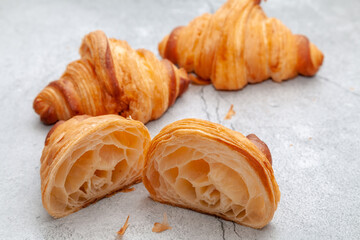 Honeycomb in sliced croissant according to the number of folds on cement background.