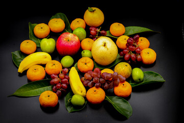 Obraz na płótnie Canvas fruits on black background