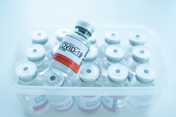 Coronavirus - 2019-nCoV or COVID-19 vaccine bottles for injection use only in a box.