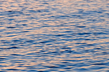Sunset sea water texture.