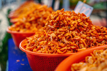 Small dried shrimp, food ingredients. Many tiny shrimps, prawns in a basket on a Vietnamese market