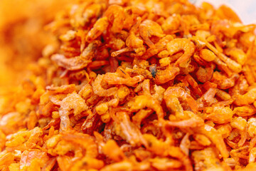 Small dried shrimp, food ingredients. Many tiny shrimps, prawns in a basket on a Vietnamese market