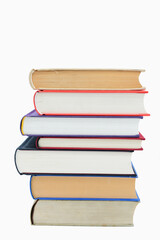 Isolated books, stacked over one another in front of a white background