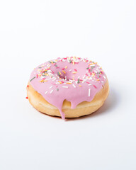 Donut decorated by sugar and pink chocolat in a white background