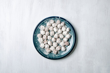 Flour dumplings and flour on a plate