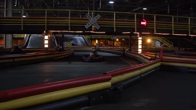 A place for karting. Children ride karts on the indoor track