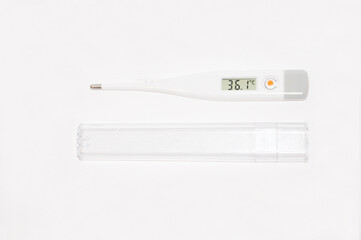 electronic white thermometer shows the temperature of a healthy person who is not sick or recovering pandemic coronovirus pneumonia medicine