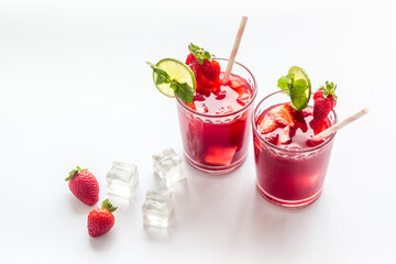 Strawberry cocktail or lemonade with ice and mint. Cold red drink