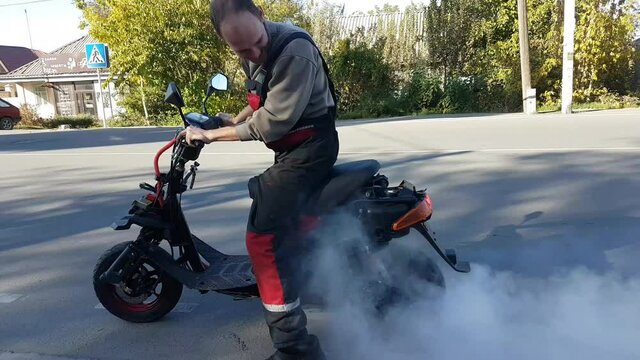 scooter burnout on the asphalt