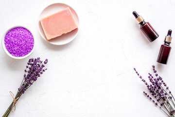 Obraz na płótnie Canvas Aromatherapy wellness background with lavender cosmetics