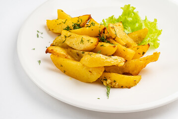fried potatoes on the white plate