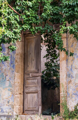 Fototapeta na wymiar Doorway of a derelict building in the beautiful town of Asos Kefalonia Greece