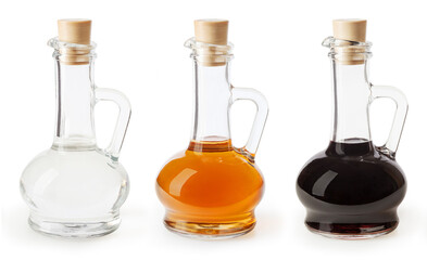 White, apple cider and balsamic vinegar in glass bottles isolated on white background