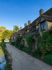 Old english country house street in the Cotswolds, England, in the countryside with a sunny day.