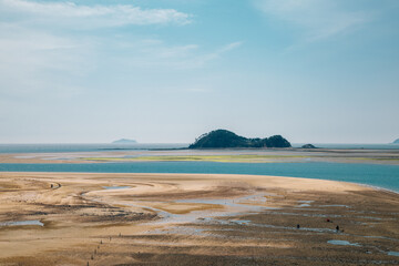 Panorama view of mud flat and sea at BaeksaJang port in Anmyeondo Island, Taean, Korea