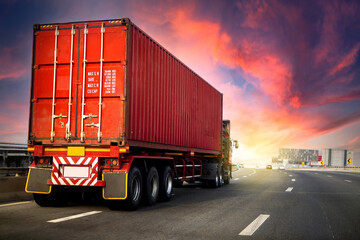 image motion blur.Truck on highway road with red container, transportation concept.,import,export logistic industrial Transporting Land transport on the asphalt expressway with sunrise sky.
