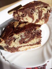 Two slices of marble cake on a white plate