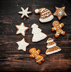 Christmas homemade gingerbread cookie on the wooden background - obrazy, fototapety, plakaty