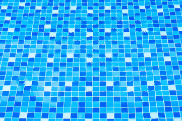 Swimming pool bottom ceramic mosaic blue and white.