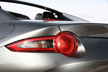 Close-up  car rear tail-lamp with a brakelight stop signal.