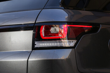 Close-up  car rear tail-lamp with a brakelight stop signal.