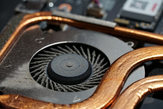 Laptop Cooling System Fan Covered With Dust Close Up Shot.