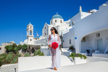 Beautiful woman in white in Santorini