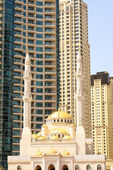 Mohammad Bin Ahmed Al Mulla mosque in Dubai against the backdrop of skyscrapers. United Arab Emirates Dubai March 2019
