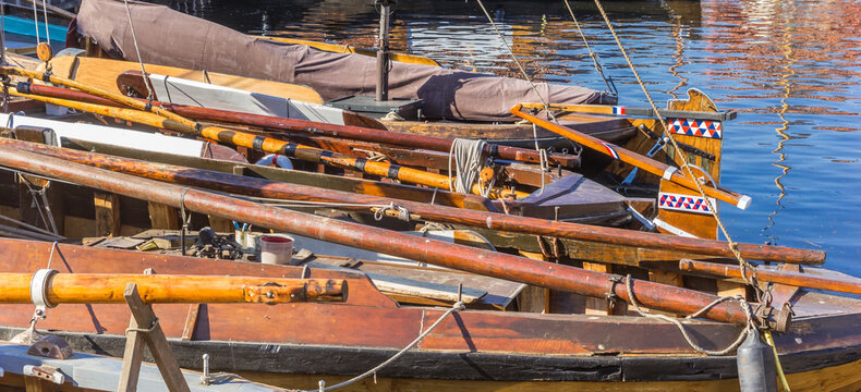 Panorama of wooden masts on historic ships in Spakenburg, Netherlands