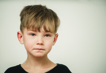 portrait of an offended and crying boy close-up