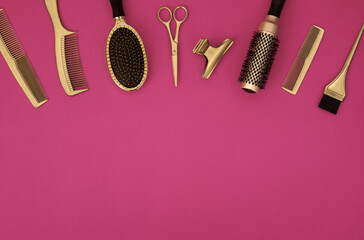 Banner with hairdressing tools. Gold hair salon accessories on pink background with space for text. Comb, scissors, brush and hairpins.