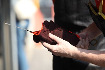 hand of a mechanic at work in his garage or car repair service or auto store, business, maintenance and people concept