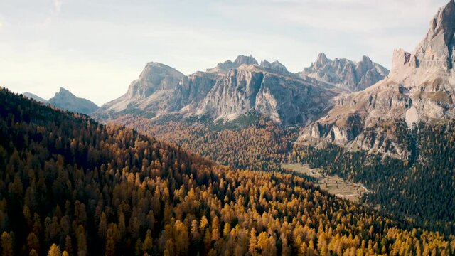 aerial shot of  Italian Dolomites on autumn, down to forest