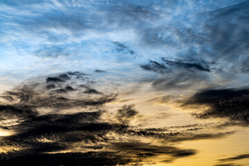 Fototapeta na wymiar Fantastic blue and yellow cloudy sky background texture