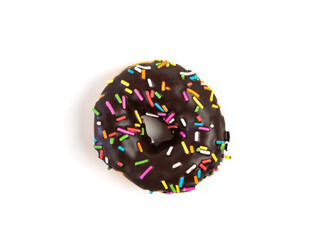 Chocolate flavoured donut with sprinkles on white background. One black doughnut isolated picture....
