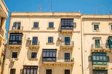 traveling the beautiful streets of Malta with old historical and new modern buildings