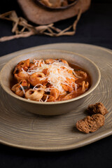 Rustic Italian Tortellini Soup in bowl on wood