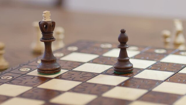 black bishop defending his king by taking white rook. chess game. Business, competition, strategy, leadership and success concept. Chess financial business strategy concept. King on the chessboard
