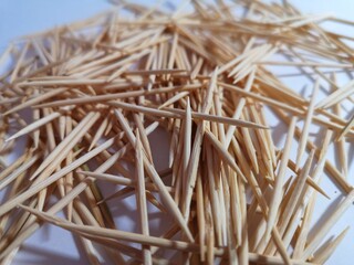 wooden toothpicks yellow on a white background a lot
