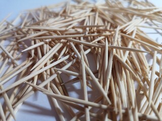 wooden toothpicks yellow on a white background a lot