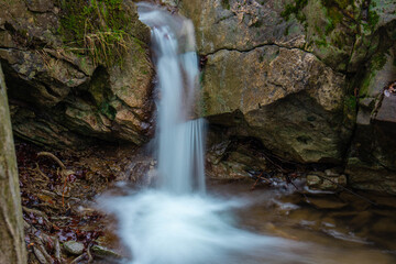 Obraz premium Little but beautiful waterfall in the woods.