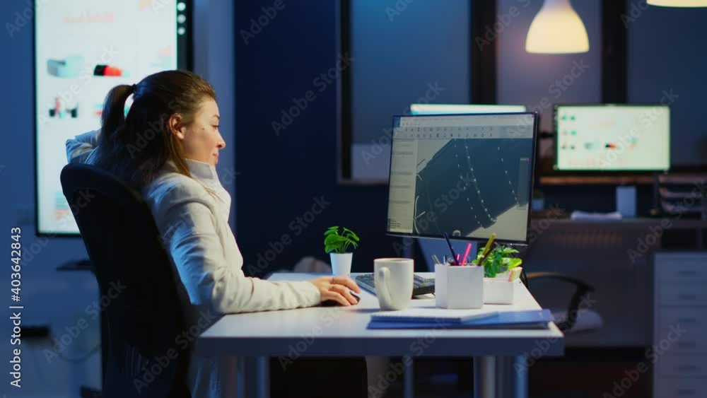 Poster tired designer engineer analizing new prototype of 3d model of the plant yawning working overtime. i