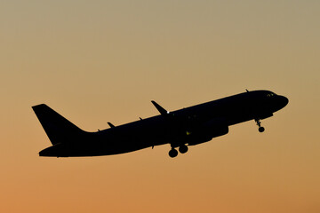 Passenger plane take-off in the evening.