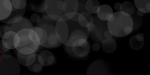 Abstract black and white bokeh background for creative design. Celebratory blurred backdrop.